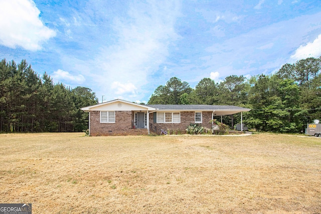 ranch-style home with a front lawn