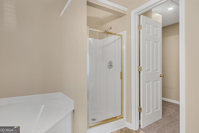 bathroom with separate shower and tub