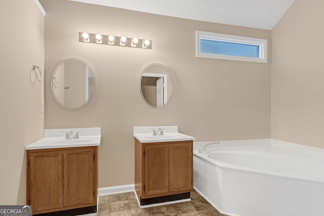 bathroom featuring vanity and a tub to relax in