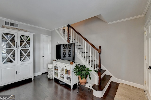 interior space featuring crown molding and hardwood / wood-style floors