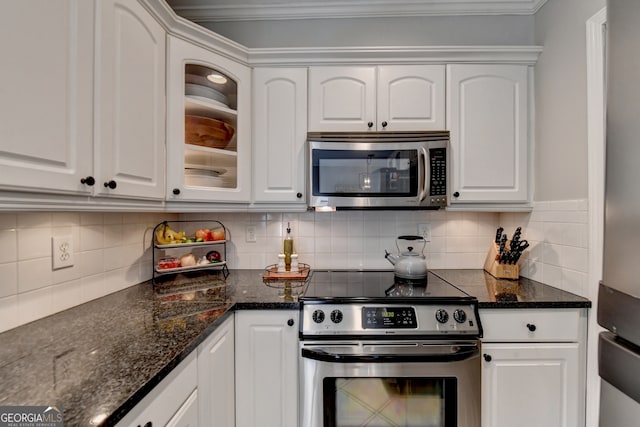 kitchen featuring white cabinetry, backsplash, stainless steel appliances, and crown molding