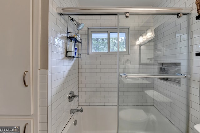 bathroom featuring shower / bath combination with glass door