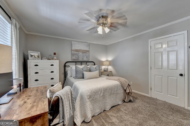 carpeted bedroom with ceiling fan and crown molding