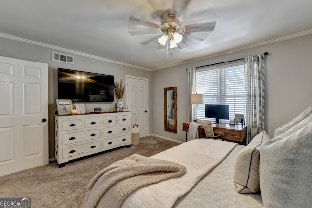 bedroom featuring ornamental molding, carpet, and ceiling fan