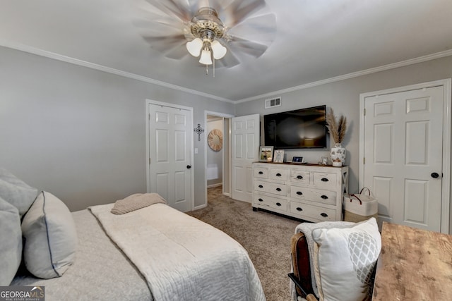 carpeted bedroom with crown molding and ceiling fan