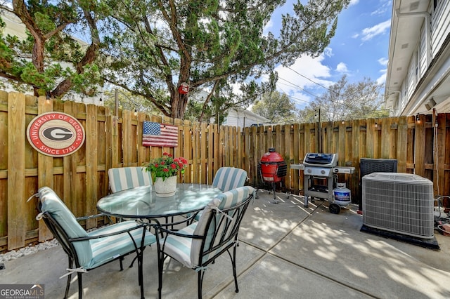 view of patio with central AC and a grill