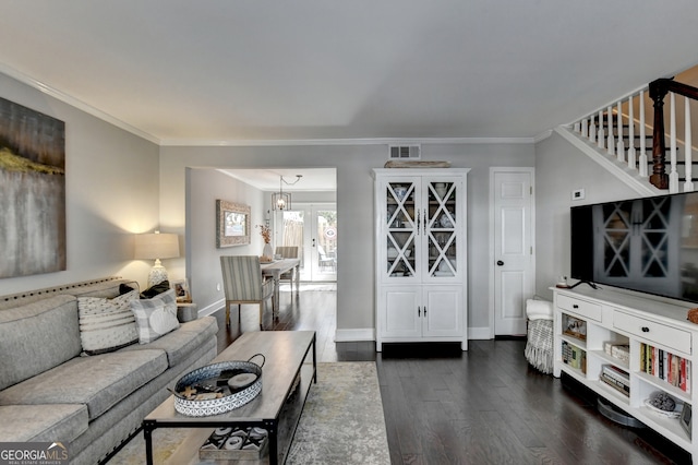 living room with ornamental molding and dark wood-type flooring