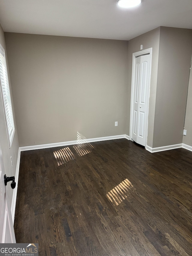 1901 Maywood Pl NW, Atlanta, GA 30318 - unfurnished room with dark wood-style flooring and baseboards