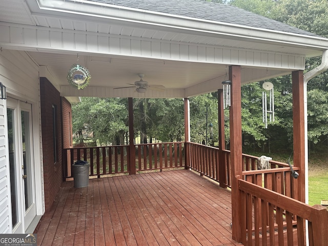 wooden terrace featuring ceiling fan