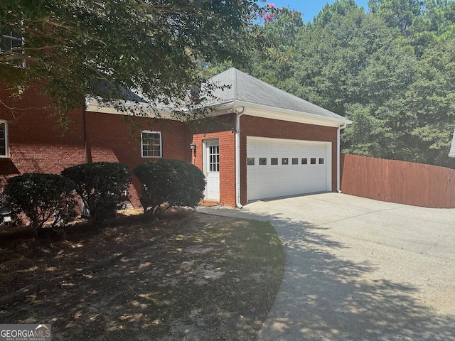 view of side of home featuring a garage