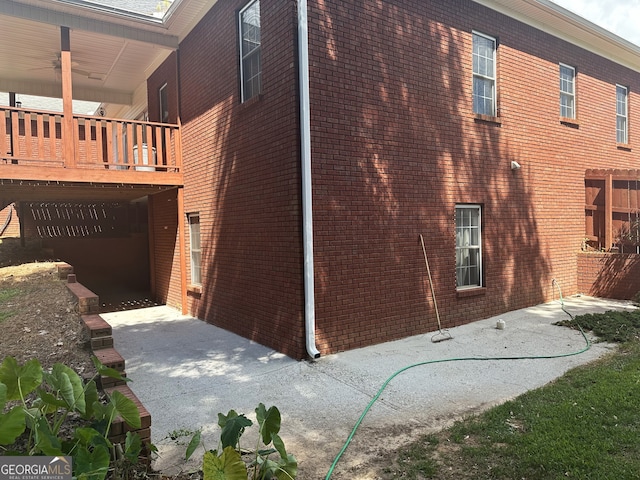 view of side of home with a patio