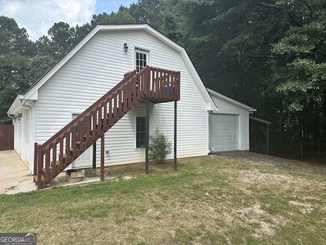 view of property exterior featuring a yard and a garage