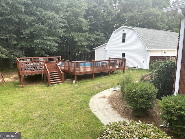 view of yard with a wooden deck