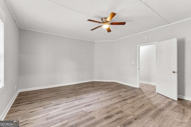 empty room with ceiling fan and light wood-type flooring