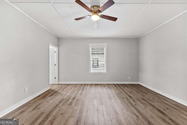 unfurnished room with ceiling fan, wood-type flooring, and ornamental molding