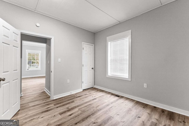 empty room with light hardwood / wood-style floors