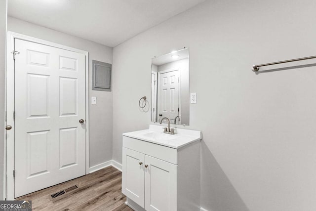 bathroom with vanity and wood-type flooring