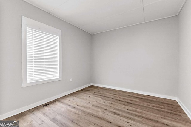 spare room featuring hardwood / wood-style floors