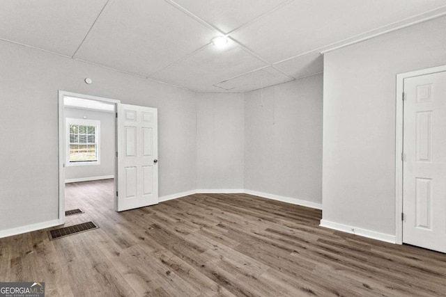 spare room featuring hardwood / wood-style floors