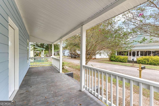 wooden deck featuring covered porch