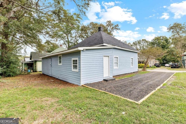 view of home's exterior featuring a yard