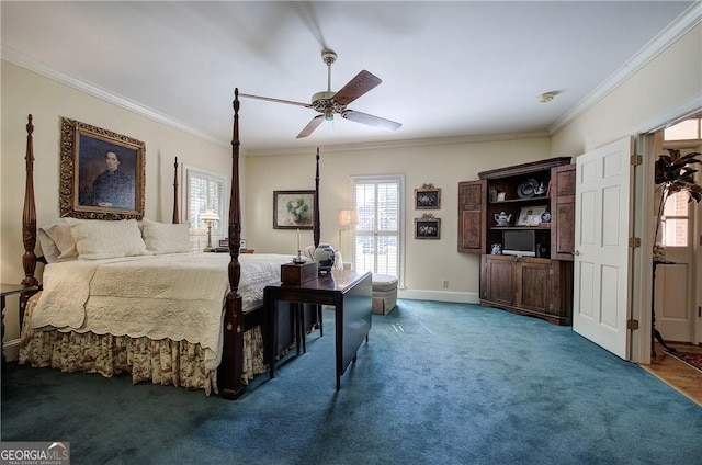 bedroom with ornamental molding, dark colored carpet, and ceiling fan