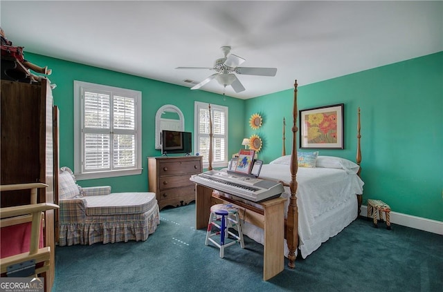 carpeted bedroom featuring ceiling fan and multiple windows