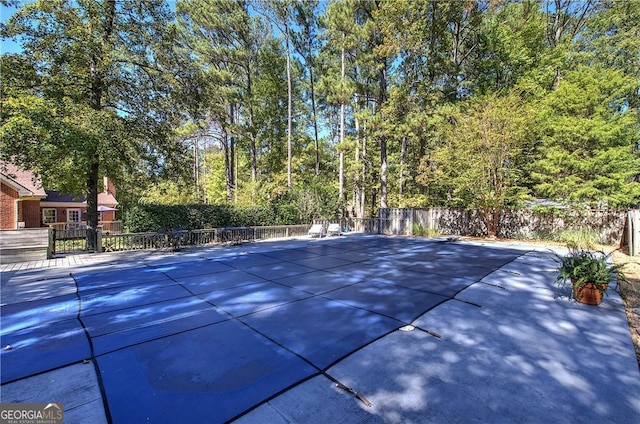 view of swimming pool with a patio