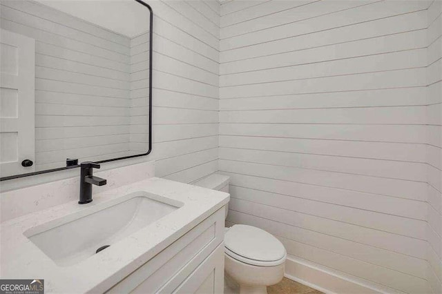 bathroom with toilet and vanity