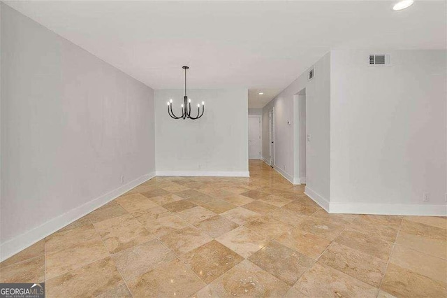 unfurnished dining area with a chandelier