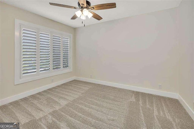 spare room with carpet flooring and ceiling fan