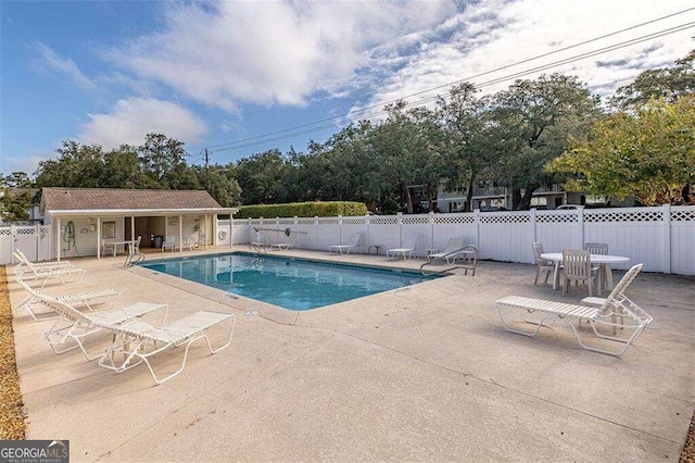 view of pool featuring a patio area