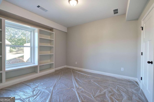 unfurnished room with light colored carpet