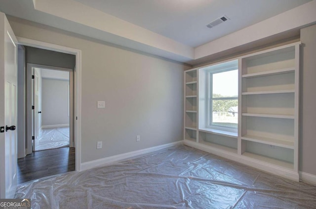 empty room featuring wood-type flooring