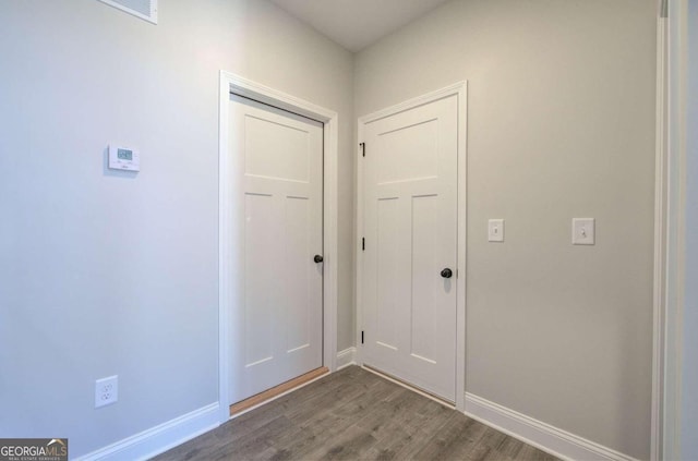 doorway with wood-type flooring