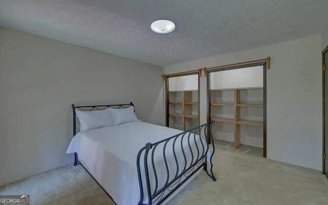 bedroom featuring light carpet