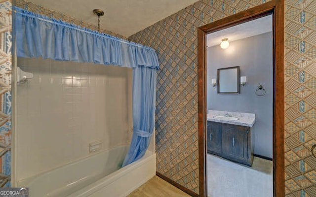 bathroom with vanity and shower / bath combo