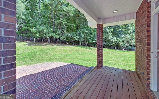 wooden deck with a yard