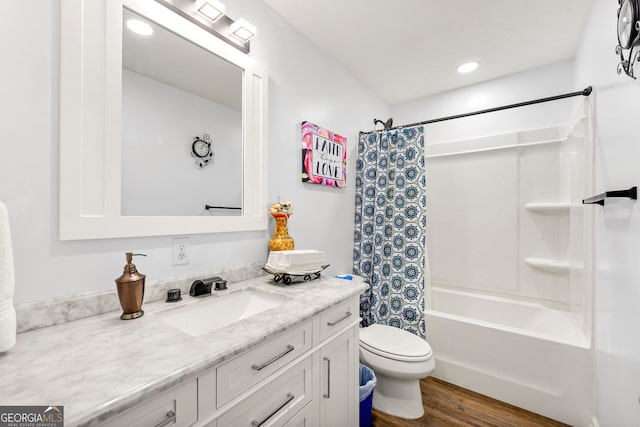 full bathroom with vanity, toilet, wood-type flooring, and shower / bath combo with shower curtain