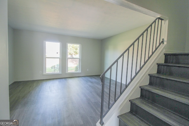 staircase featuring hardwood / wood-style flooring