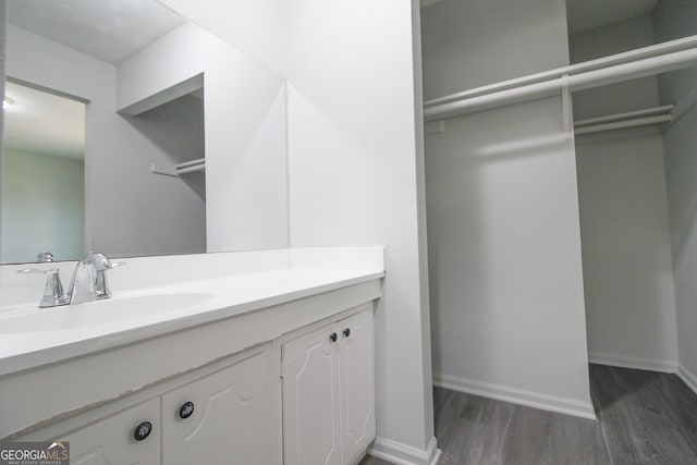 bathroom with vanity and hardwood / wood-style flooring