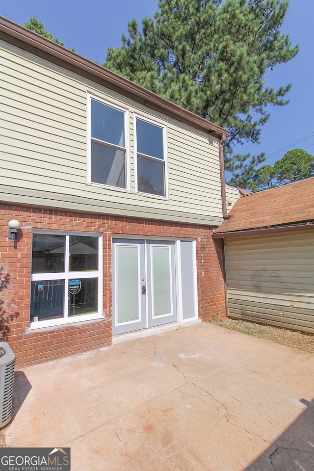 back of property featuring a patio area and central AC unit