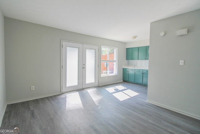 interior space with french doors and dark wood-type flooring