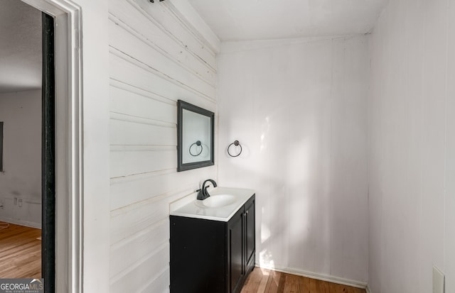 bathroom featuring vanity and hardwood / wood-style flooring