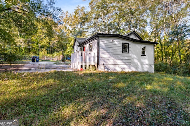 view of property exterior featuring a yard