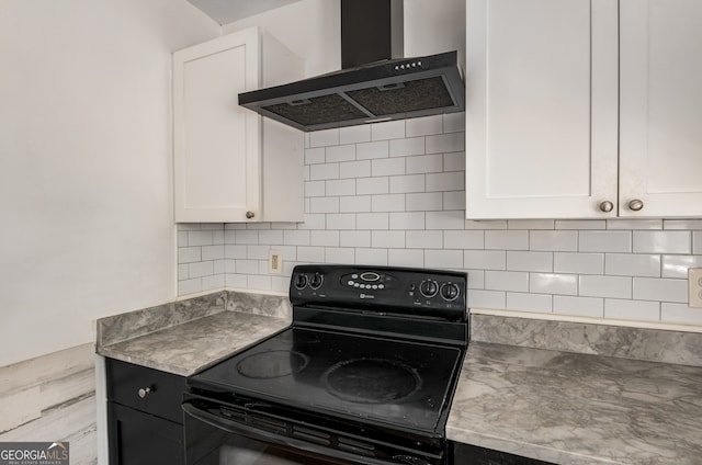 kitchen featuring black range with electric stovetop, white cabinets, wall chimney range hood, and backsplash