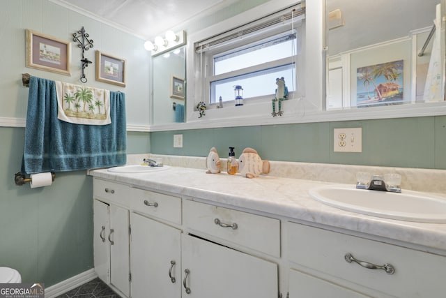 bathroom with vanity and ornamental molding