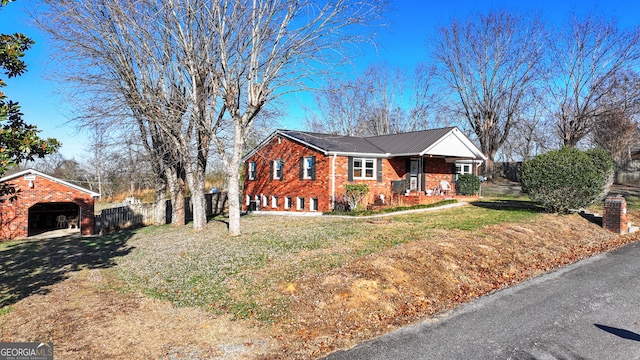 view of front of house featuring a front yard and a garage