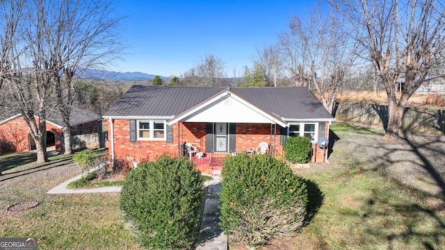 view of front facade with a front yard and a mountain view