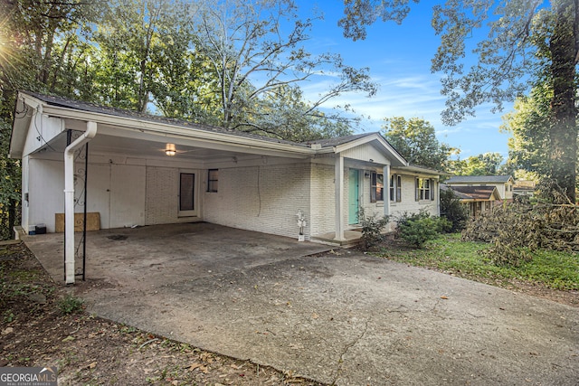 view of side of property featuring a carport